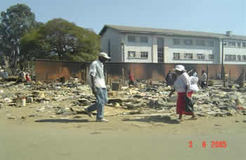 Informal traders in St Marys' Chitungwiza taking what remains of their property 