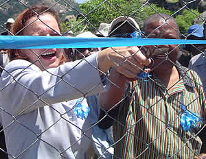 Roxanne Dubé cuts the ribbon to officially open the fencing made at Chikuku Centre