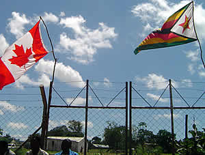 Solidarity! The Canadian flag flies high next to the Zimbabwean flag