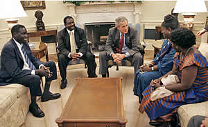 Reginald Matchaba-Hove next to US President George Bush alongside the three other recipients of the 2006 Democracy Award