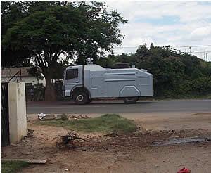 One of the imported Israel water tanker patrols the streets of Highfield surburb. IRIN News reports that some supporters who sought refuge in homes in the township were followed and beaten by the police. © LAZELE