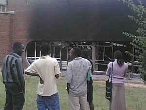 Students discuss what could have caused the building to go up in flames. According to The Herald newspaper, there have been 10 'terror petrol bombs' in the country