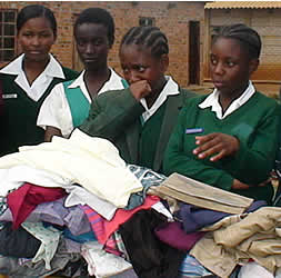 Students from Girls High School Rights Club presenting donations to Yemurai Secondary School in Dzivarasekwa