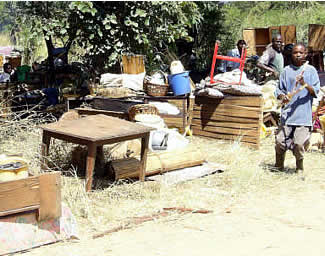Household goods out in the open after homes destroyed by political violence