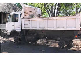 National Parks truck up on stands with no tyres. 
