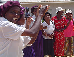 Women from Dzidzai Foundation Trust welcoming Canadian ambassador Roxanne Dubé